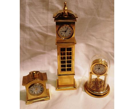 Three miniature brass quartz clocks. P&amp;P Group 1 (£14+VAT for the first lot and £1+VAT for subsequent lots) 