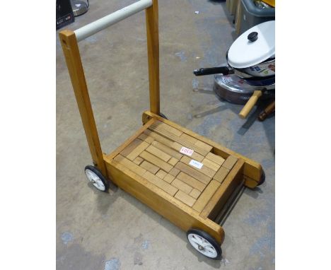 Vintage wooden building blocks set within a push-along trolley. P&amp;P Group 3 (£25+VAT for the first lot and £5+VAT for sub