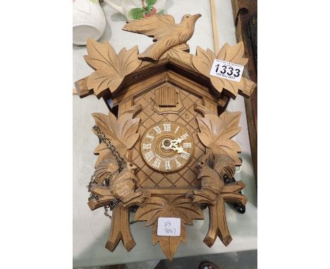 Carved German cuckoo clock with weights and pendulum, 30 x 18 x 13 cm. Not available for in-house P&amp;P 