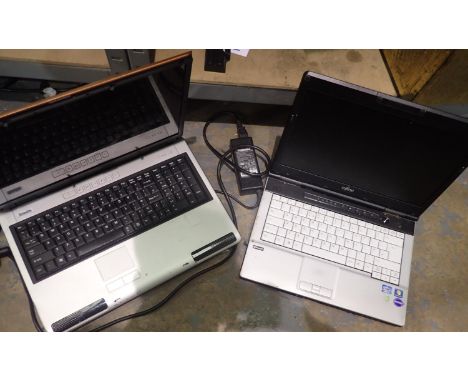 Two laptops, Toshiba and Fujitsu, charger for Toshiba only, both untested. P&amp;P Group 3 (£25+VAT for the first lot and £5+