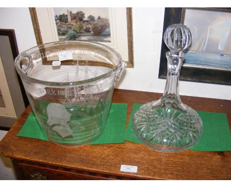 An engraved glass wine bucket together with ships decanter