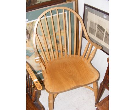 An antique style stick back country armchair