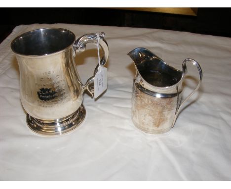 A silver footed tankard together with cream jug