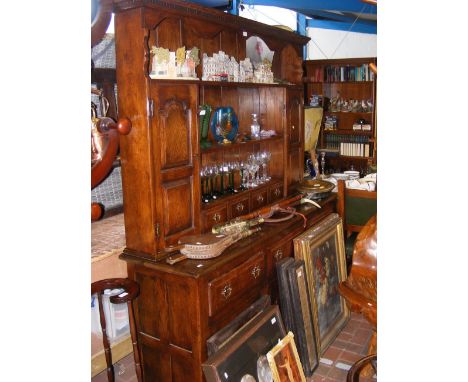 A dark oak dresser with mounted brass handles - length 168cm 