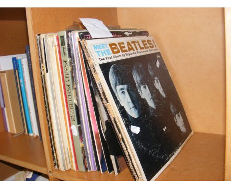 Assorted vinyl LP records, including Meet The Beatles and Beatles 65 