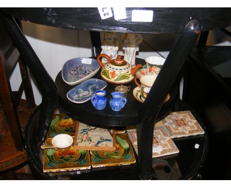 Victorian tiles, together with Isle of Wight pottery trinket dishes and other ceramics - on two shelves 