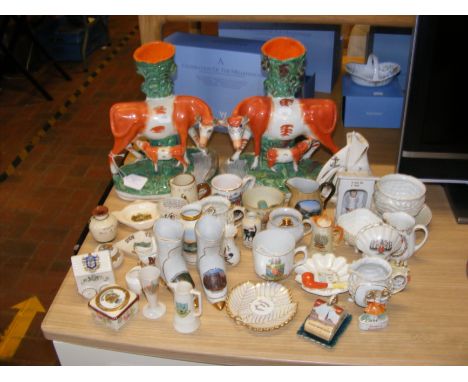 A pair of Staffordshire pottery cow and calf vases, together with crested ware and other collectable ceramics 