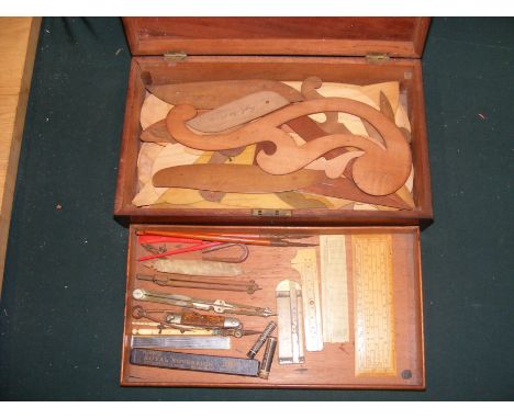 A collection of drawing instruments, including Georgian ruler and various French curves in mahogany toolbox 