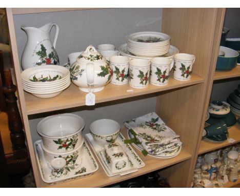 A collection of Portmeirion 'Christmas' pattern tableware - on two shelves