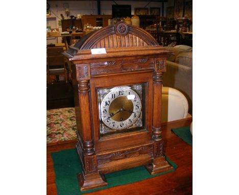 A 48cm high striking bracket clock with classical column design