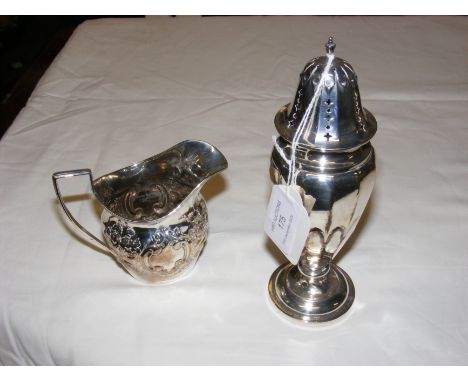 A silver sugar shaker and cream jug