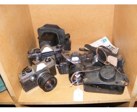 Assorted vintage cameras, including Praktica Super TL1000 and Minolta X-700 