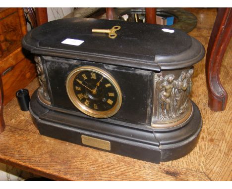 A Victorian slate and bronze mounted mantel clock