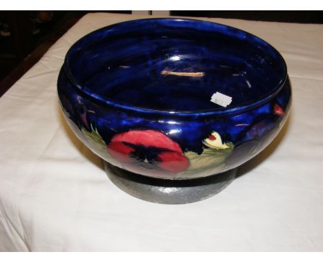 A 22cm diameter Tudric Moorcroft Pottery bowl with tube line decoration