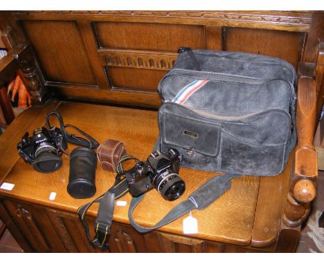 Vintage photographic equipment, including Nikkormat and Nikon EM Camera 