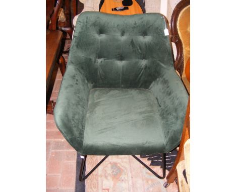 A contemporary green velour button back easy chair 