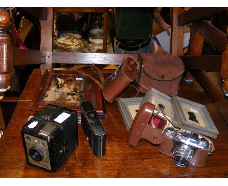 Vintage cameras, including Coronet Ambassador, together with old pictures and a sampler  