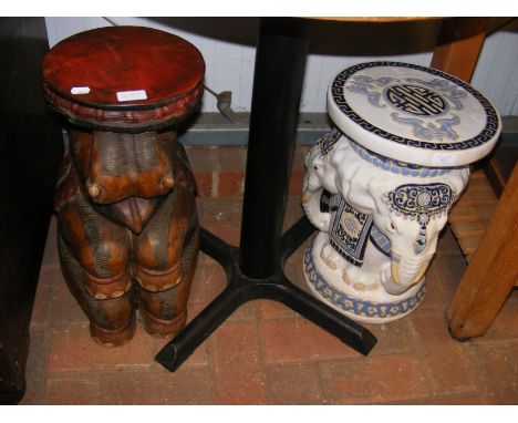 A ceramic Elephant planter with similar wooden variety 