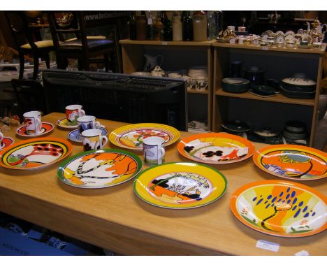 A set of seven 1990's Wedgwood 'Biyanne Living Landscapes of Clarice Cliff' plates, together with Clarice Cliff 'Cafe Chic' c