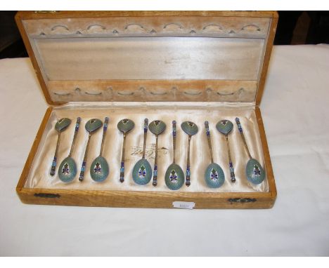 A set of twelve, late 19th century Russian silver gilt and enamel coffee spoons, having makers mark - each spoon 10cms long, 