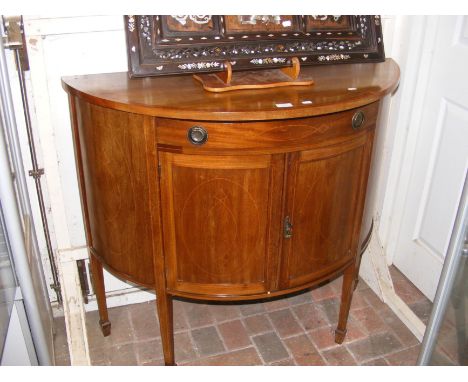 A 100cm half round mahogany sideboard with drawer and cupboard below