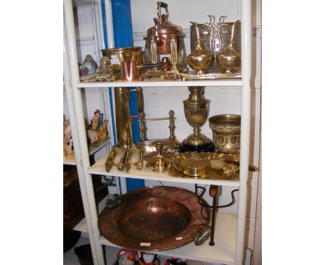 Assorted brass and copper metalware, including kettle on stand above burner - on three shelves 