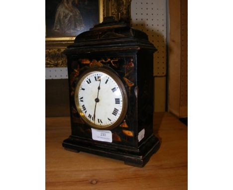 A 24cm high japanned mantel clock