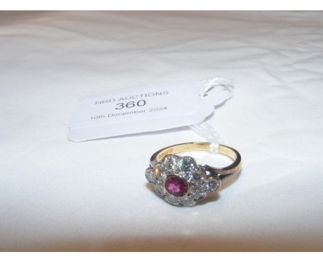 An 18ct diamond and ruby ring CONDITION REPORT We have attached a number of additional images to showcase the lot in further 