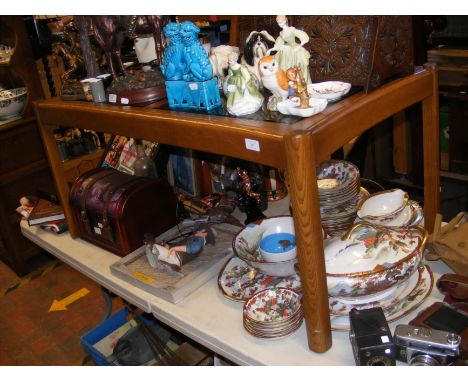 An Ercol glass top coffee table - length 107cm 