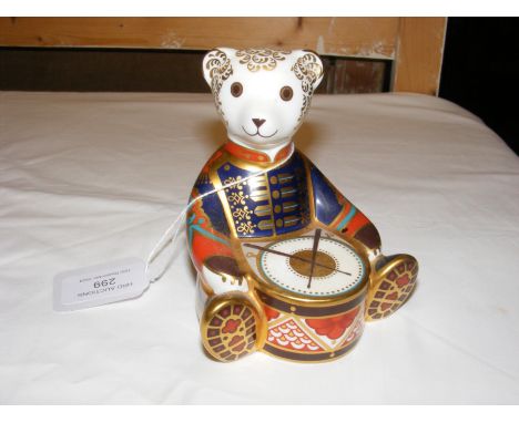 A Royal Crown Derby paperweight in the form of a drummer bear