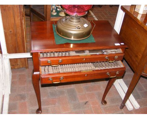 A Mappin & Webb canteen of cutlery in fitted two drawer side table