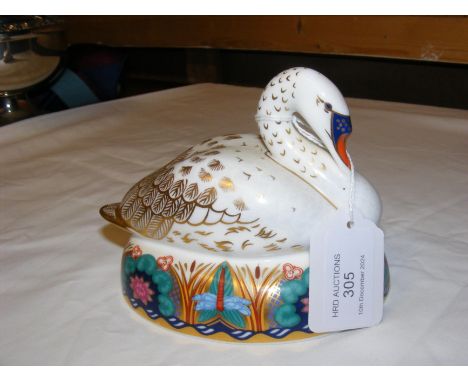 A Royal Crown Derby paperweight in the form of a swan