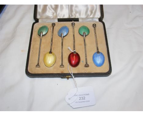 Solid silver and enamel teaspoons in presentation case
