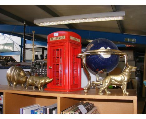 A miniature red telephone box with wired phone, brass pigs and dog, a gemstone globe and vintage bookstand 