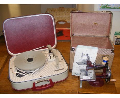 A miniature Essex sewing machine together with a Fidelity portable electric record player