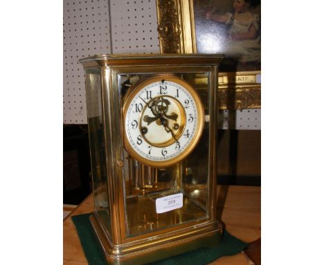 A 27cm high four glass mantel clock, with visible escapement