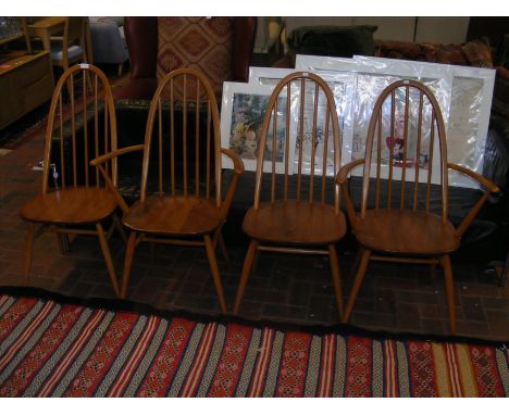 Four vintage mid century Ercol hoop back and spindle dining chairs (two plus two) 