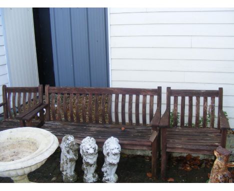 A wooden garden bench with matching seats