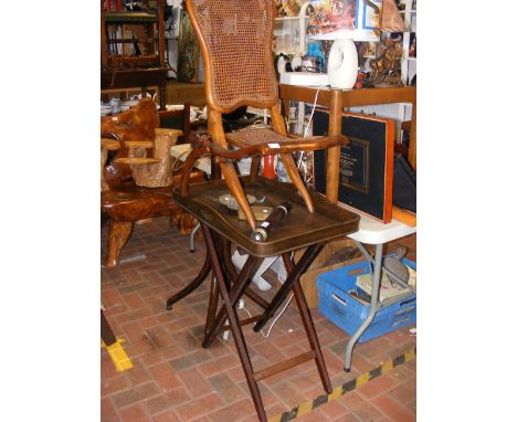 A folding steamer chair with cane seat and back, together with a folding Butler's tray 