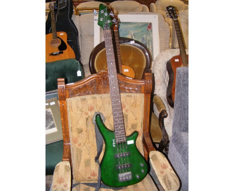 A Shine electric four string bass guitar