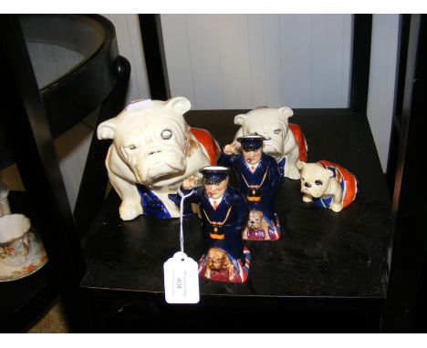 A trio of Royal Doulton graduated English Bulldogs, together with a pair of K F 'Mini Winston Churchill' ornaments (Nos. 122 