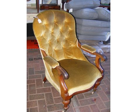 A Victorian armchair with button back