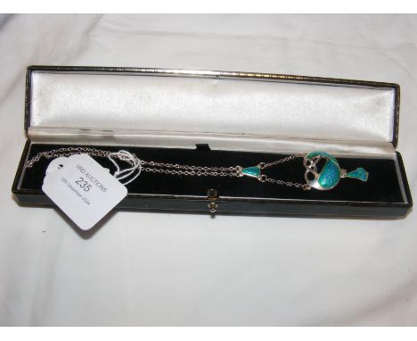 A silver and enamel pendant on chain