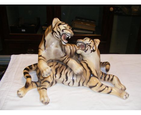 A ceramic figural group of tigers