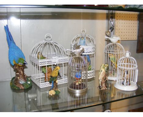 A selection of model birds (some in cages)