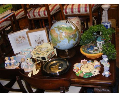 A miniature garden model, desk globe, cuckoo clocks, etc. 