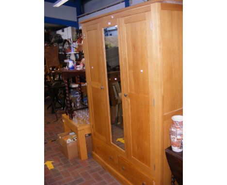 A contemporary light oak wardrobe with central mirror and square metal handles - width 140cm  CONDITION REPORT Width 140cmHei