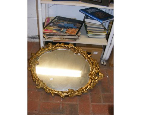 Model railway books, vinyl records and a gilt framed oval mirror 