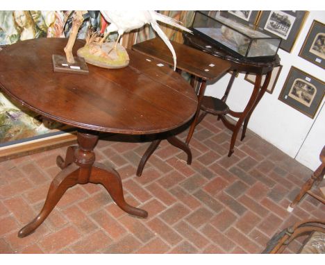 An antique oak tripod table with carved base, together with two other occasional tables CONDITION REPORT Diameter, 83cm