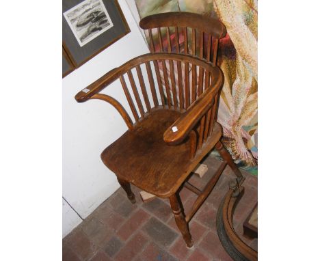 An antique stick back country chair